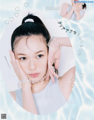 A magazine page with a picture of a woman wearing a headband.