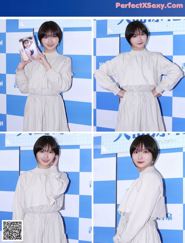 A woman in a white dress posing for a picture.